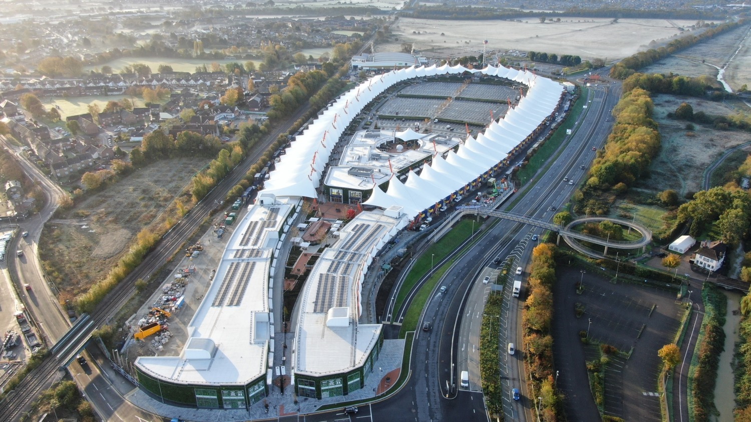 An aerial view of a building in the middle of a city.
