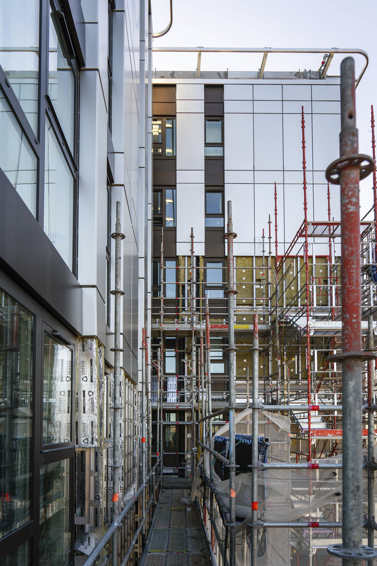 A building with a lot of pipes in front of it.