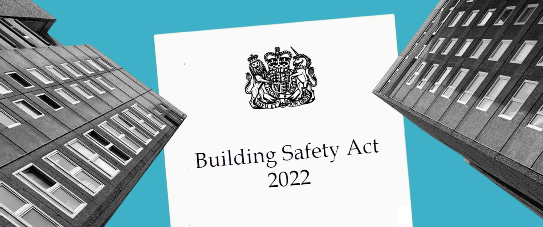 A building safety act sign in front of some tall buildings.