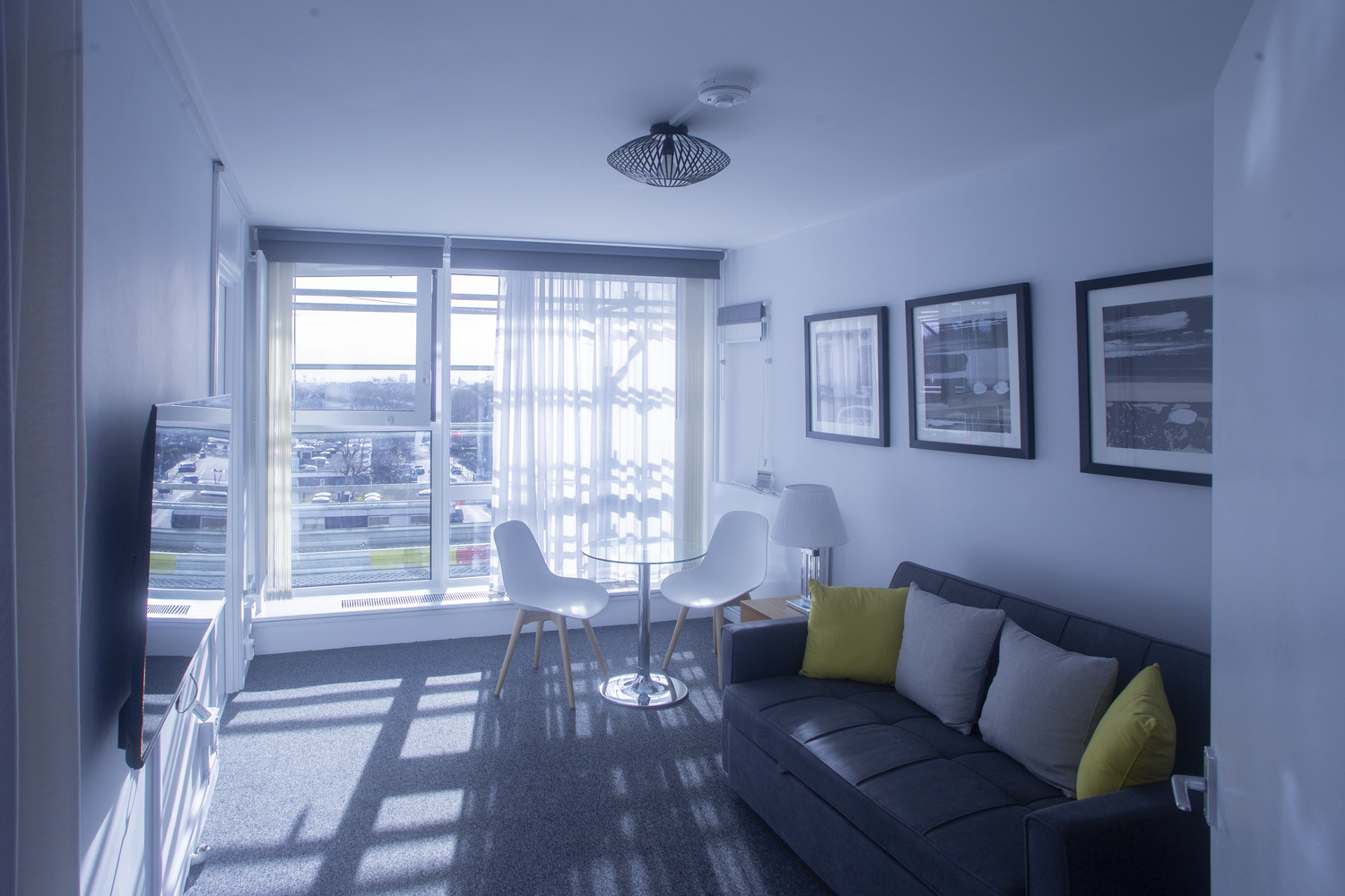 A living room filled with furniture and a flat screen tv.
