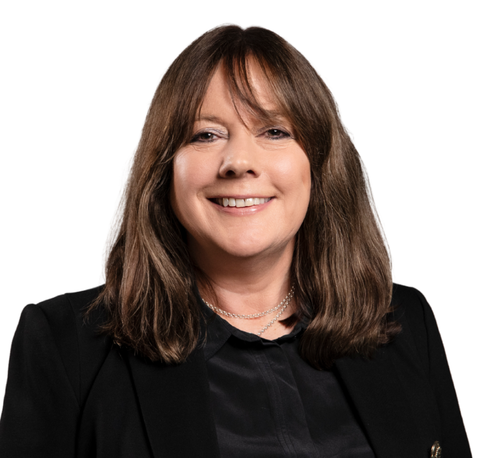 A woman with long brown hair and a black shirt.