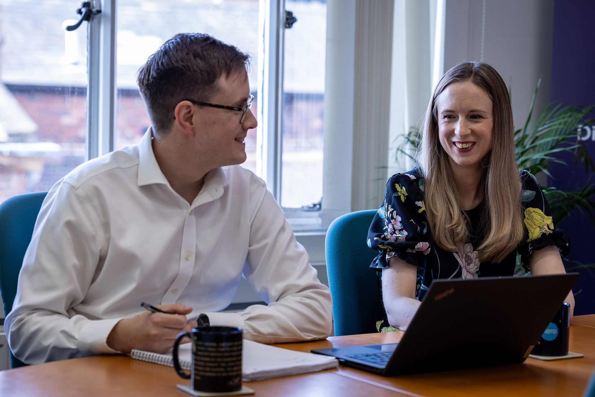 Thomas and Marie Szczepanski smiling while working on a project 