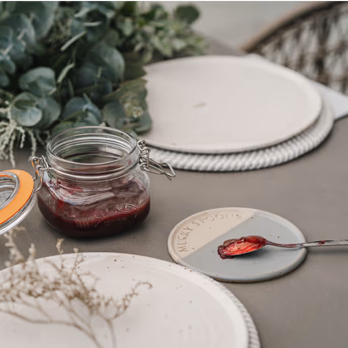 A breakfast table with jam.
