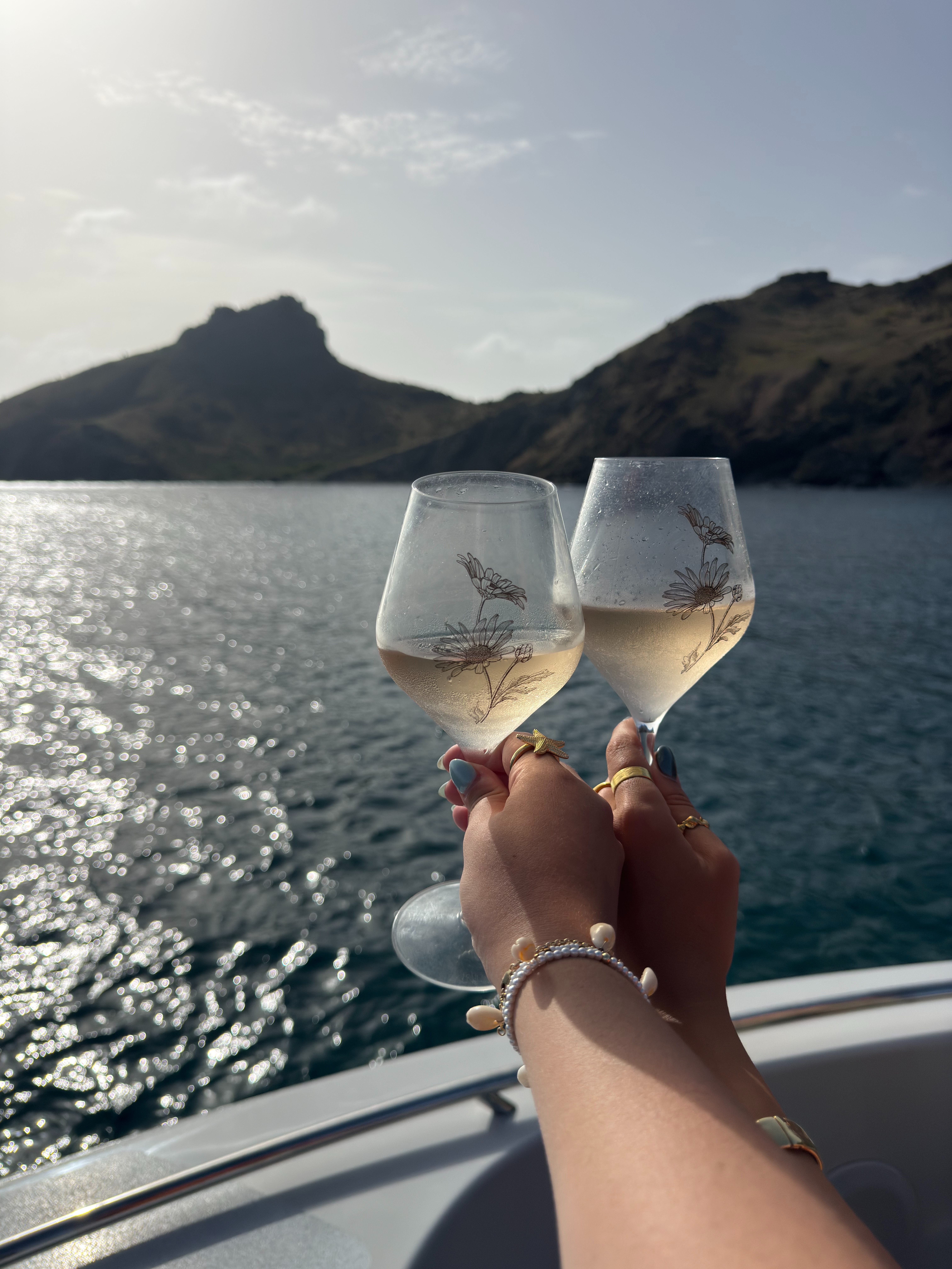 Champagne toast aboard a private yacht during a sunset cruise around St. Barths.