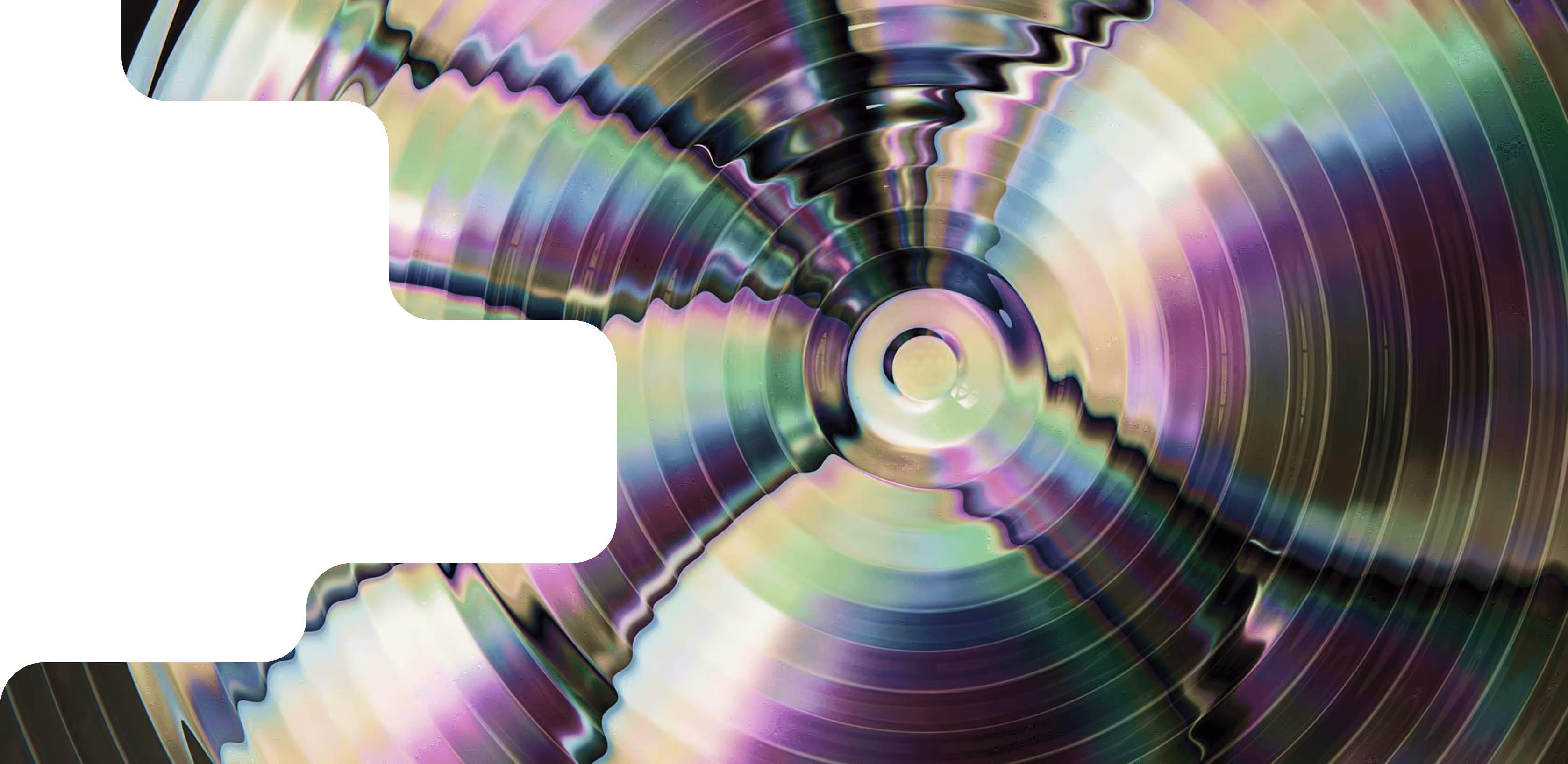 A close up of a cd disc on a green background.