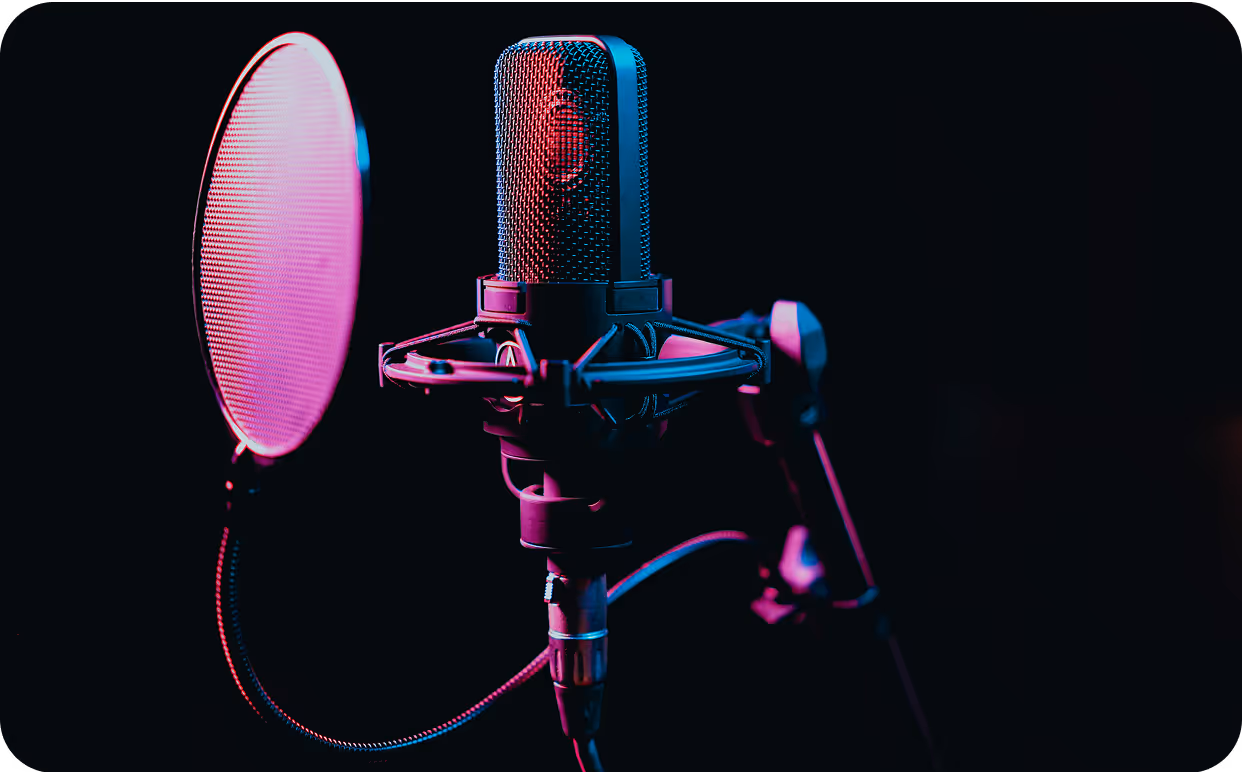 A microphone with a pink light on it.