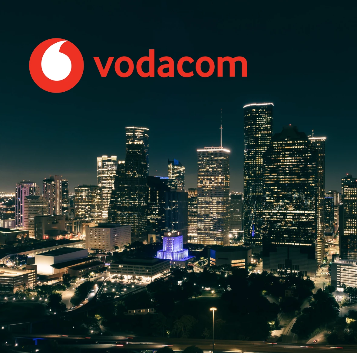 Vodacom over a night-time city skyline