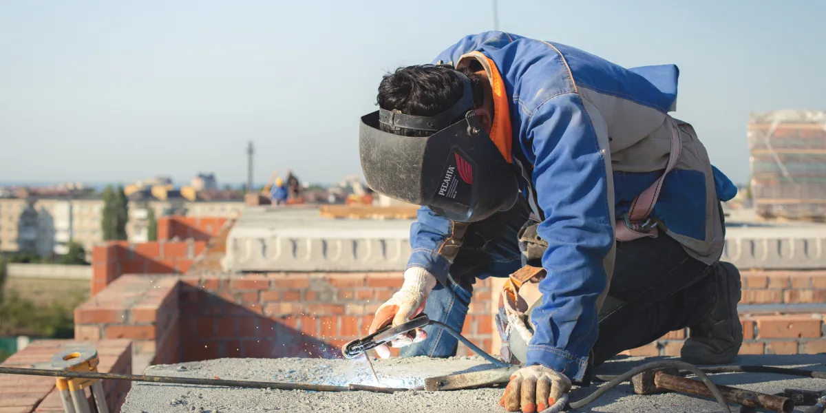 Welder working on project outside