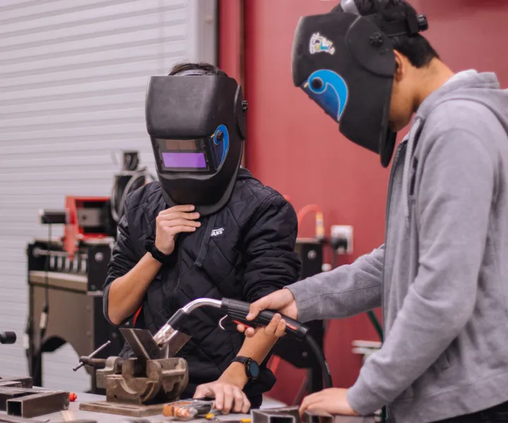 Students working on welding test project