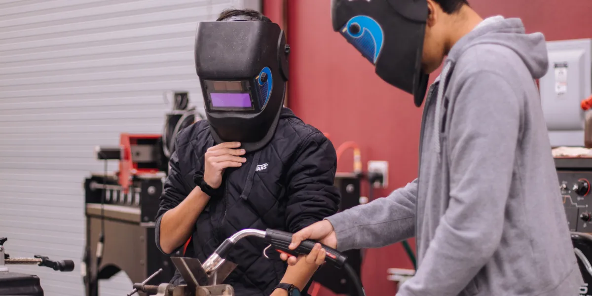 Students working on welding test project