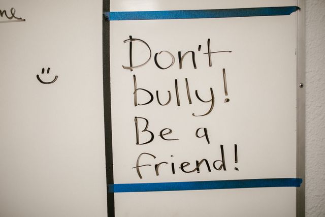 What to Do When Your Child Experiences Hijab Bullying at School  Blog image: A white board with the message "Don't bully! Be a friend!"