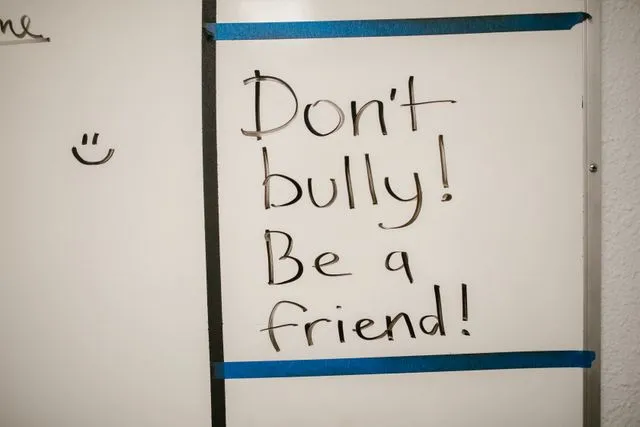 What to Do When Your Child Experiences Hijab Bullying at School Blog image: A white board with the message "Don't bully! Be a friend!"