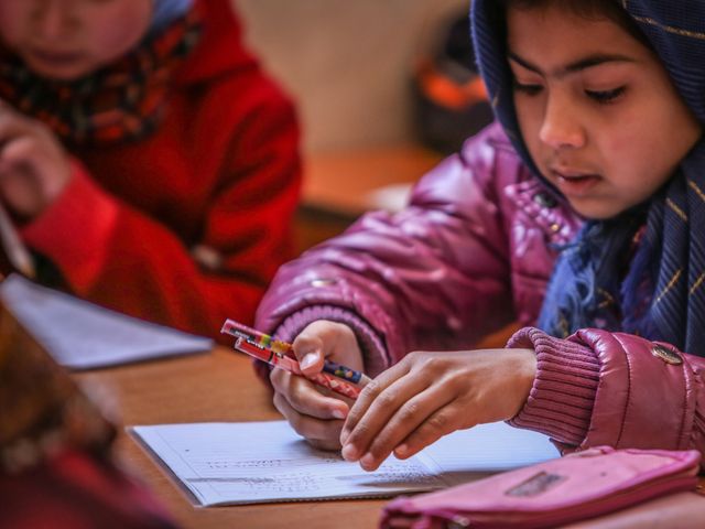 How to Help Muslim Children Handle Peer Pressure a School: A Muslim girl studying in school