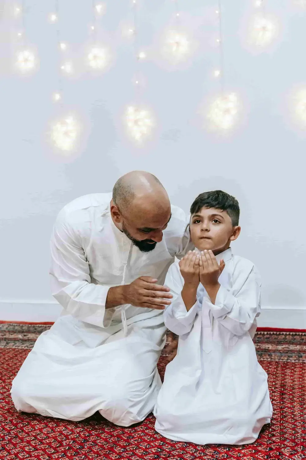 Raising High-Value Children Through Islamic Ethics Blog Image: Father and son praying together