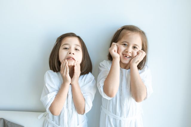 How to Deal with Sibling Rivalry through Fairness and Mercy: 2 sisters standing together