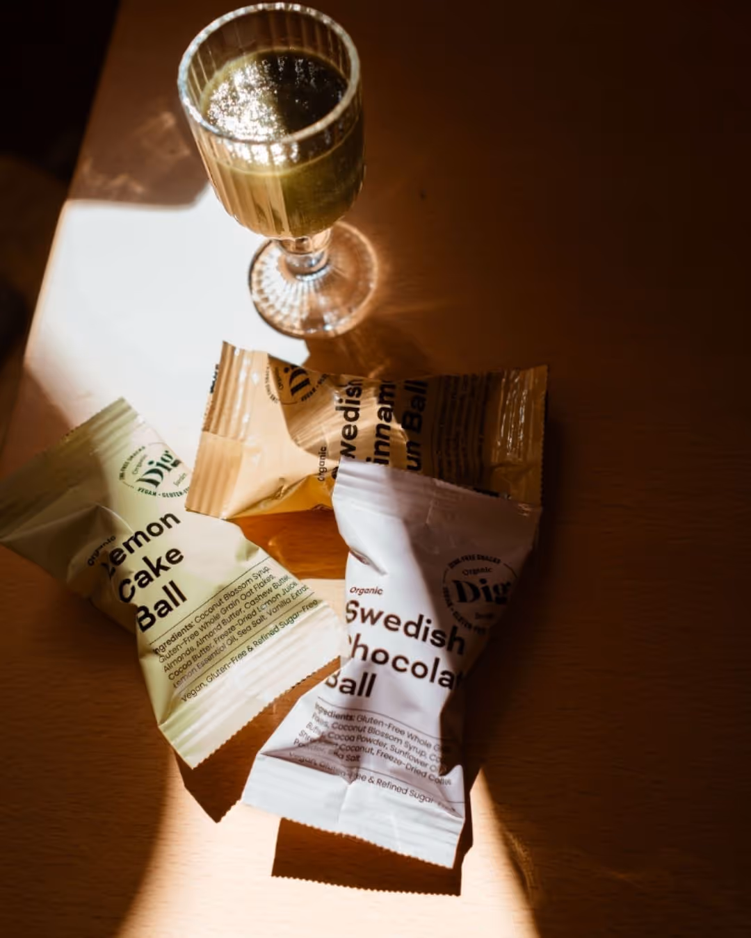 Close-up of organic swedish snacks and a green smoothie on a sunlit table in a café in Stockholm