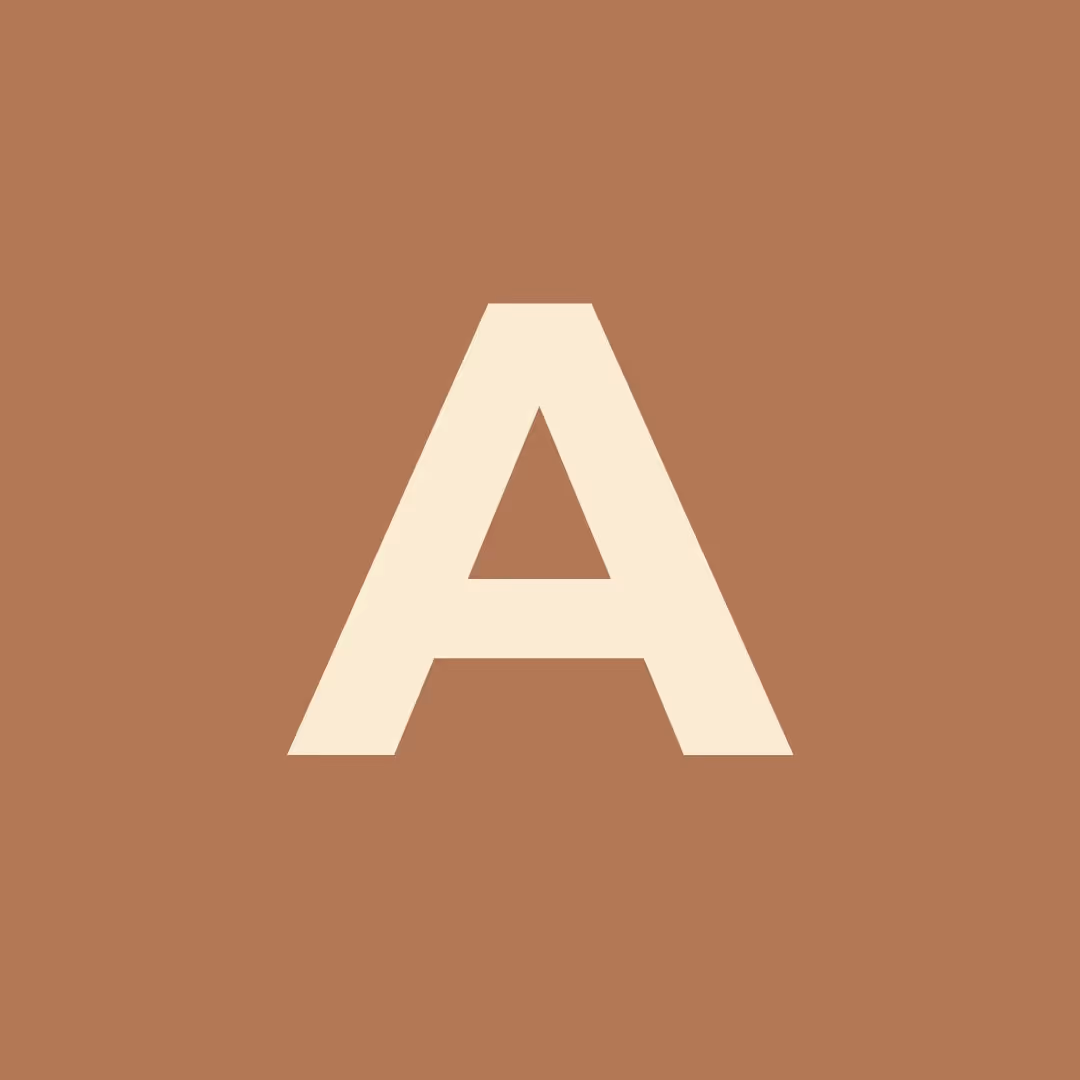Large cream letter A on a brown square background.