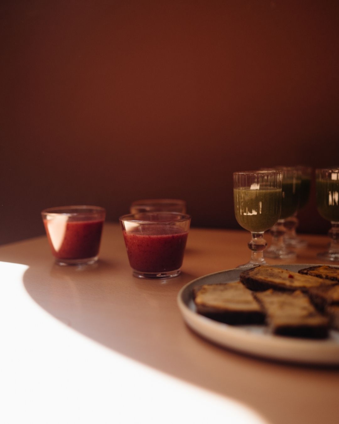Close-up of organic swedish snacks and a green smoothie on a sunlit table in a café in Stockholm