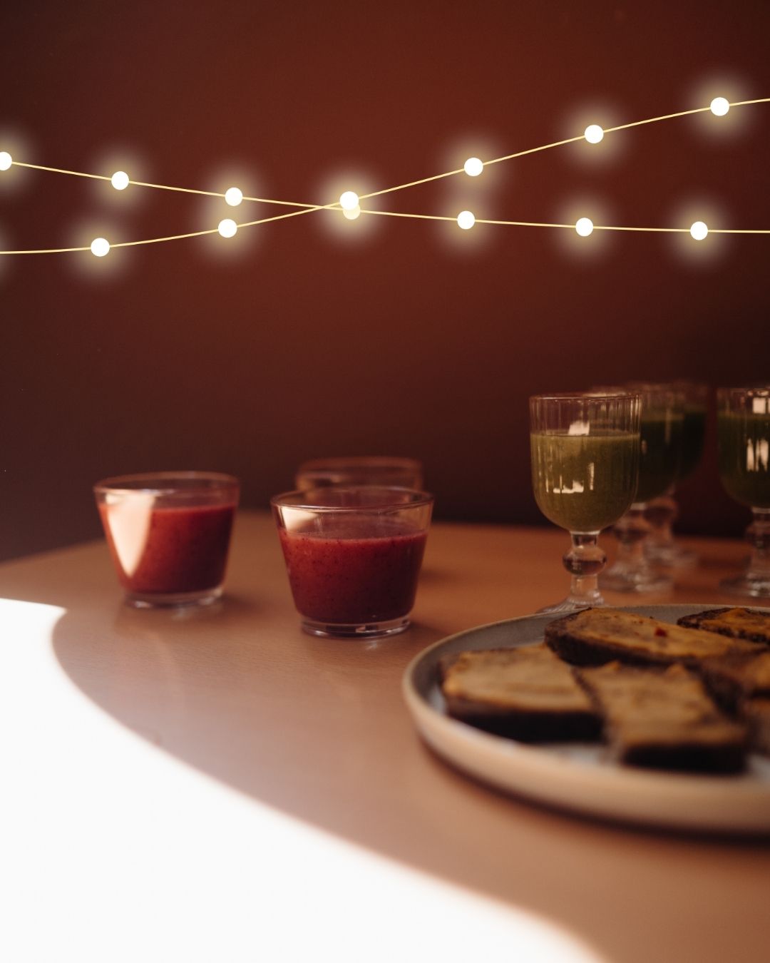 Close-up of organic swedish snacks and a green smoothie on a sunlit table in a café in Stockholm