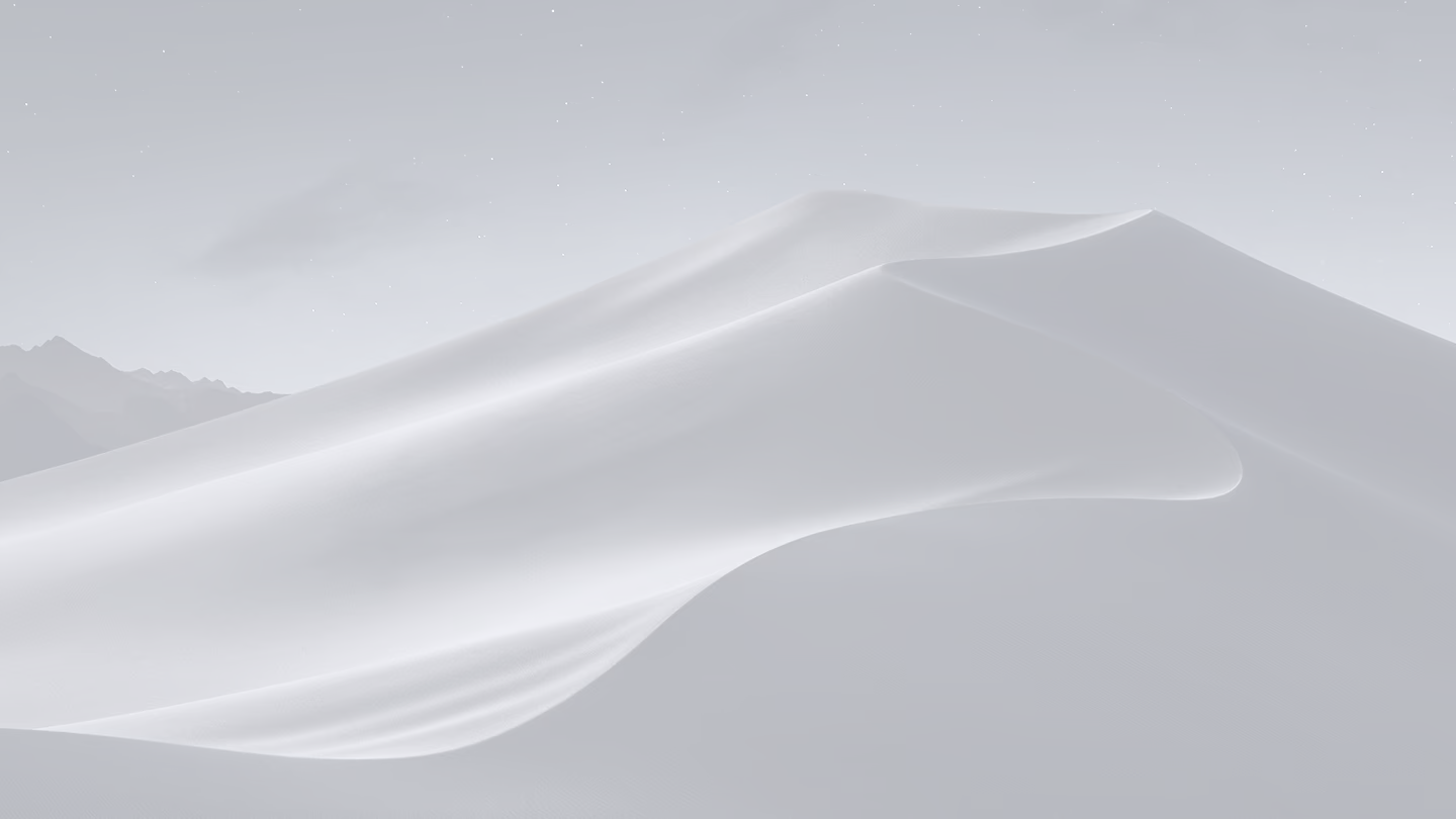 A mountain covered in snow under a night sky.