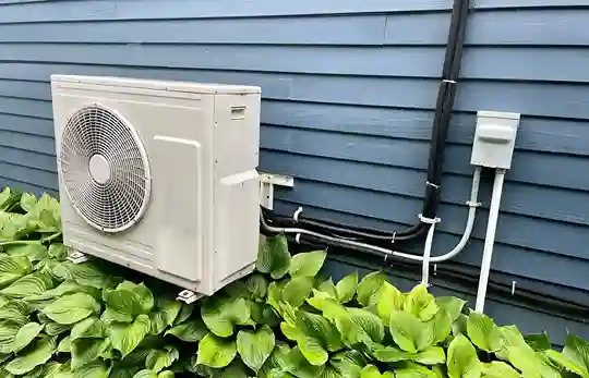 Outdoor ductless mini-split heat pump installed by NW Energy Conservation.