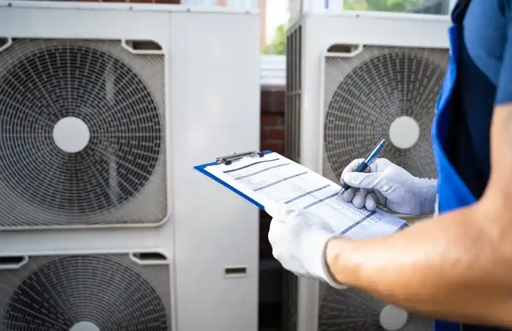 An HVAC tech writes a report on a faulty residential AC unit in Tacoma, WA. 
