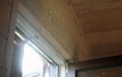 Dust particles floating in the air indicating poor indoor air quality