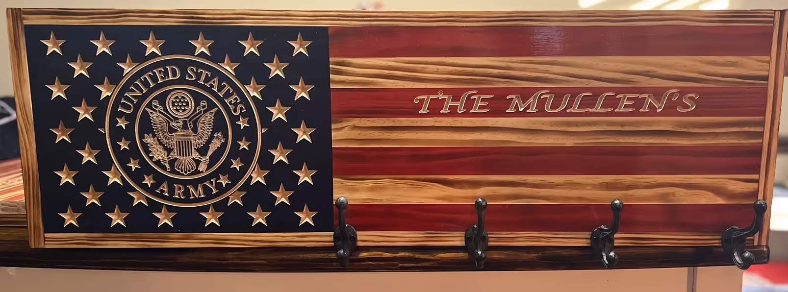 Wooden U.S. Army flag plaque with 4 metal hooks and inscription The Mullen's.