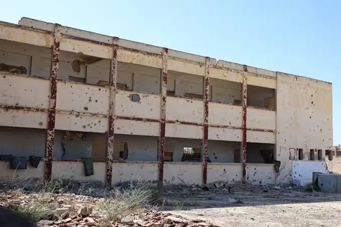 War-damaged school building in rural Homs undergoing rehabilitation