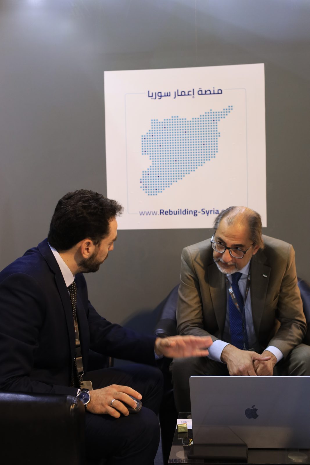 A meeting at the Rebuilding Syria Platform stand