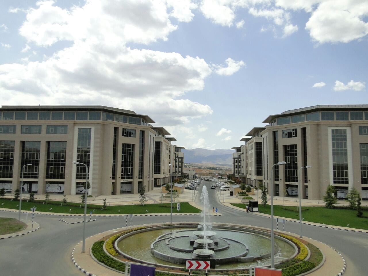 Office buildings on either side of a fountain roundabout at The Eighth Gate development, Yaafour, Rural Damascus