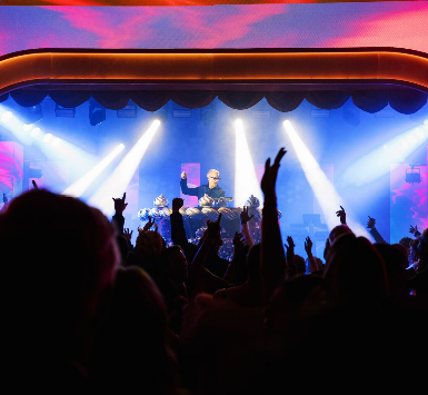 Audience with hands up at a FlyteVu produced event