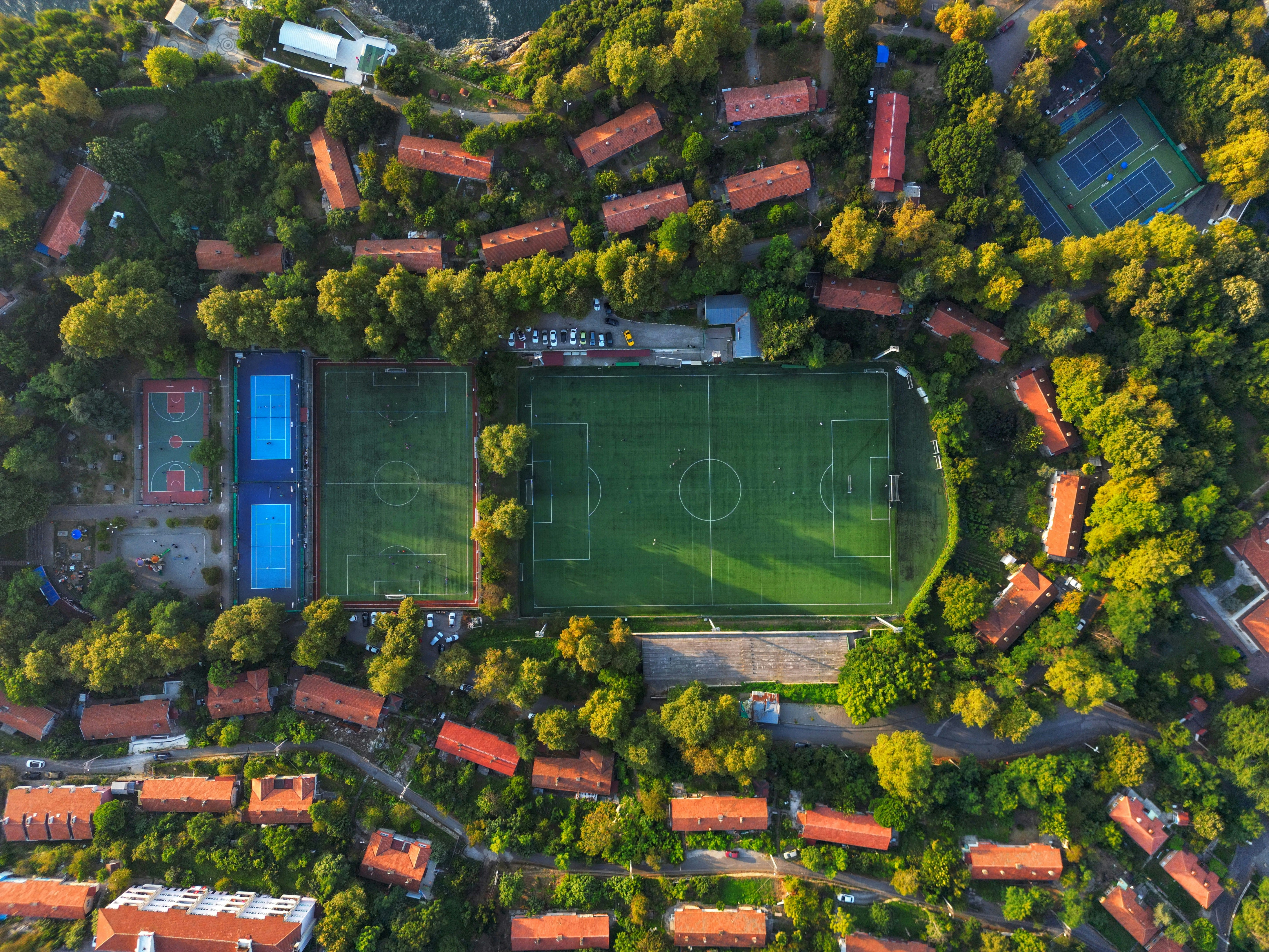 Aerial shot of a football pitch surrounded by houses.