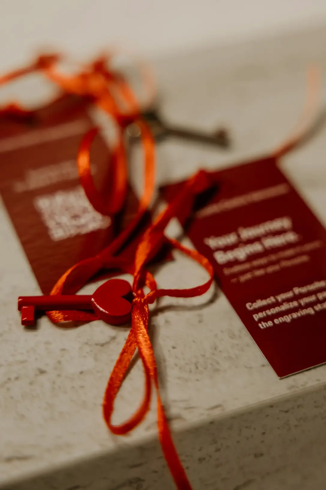 Gift box with red ribbon at an event celebration.