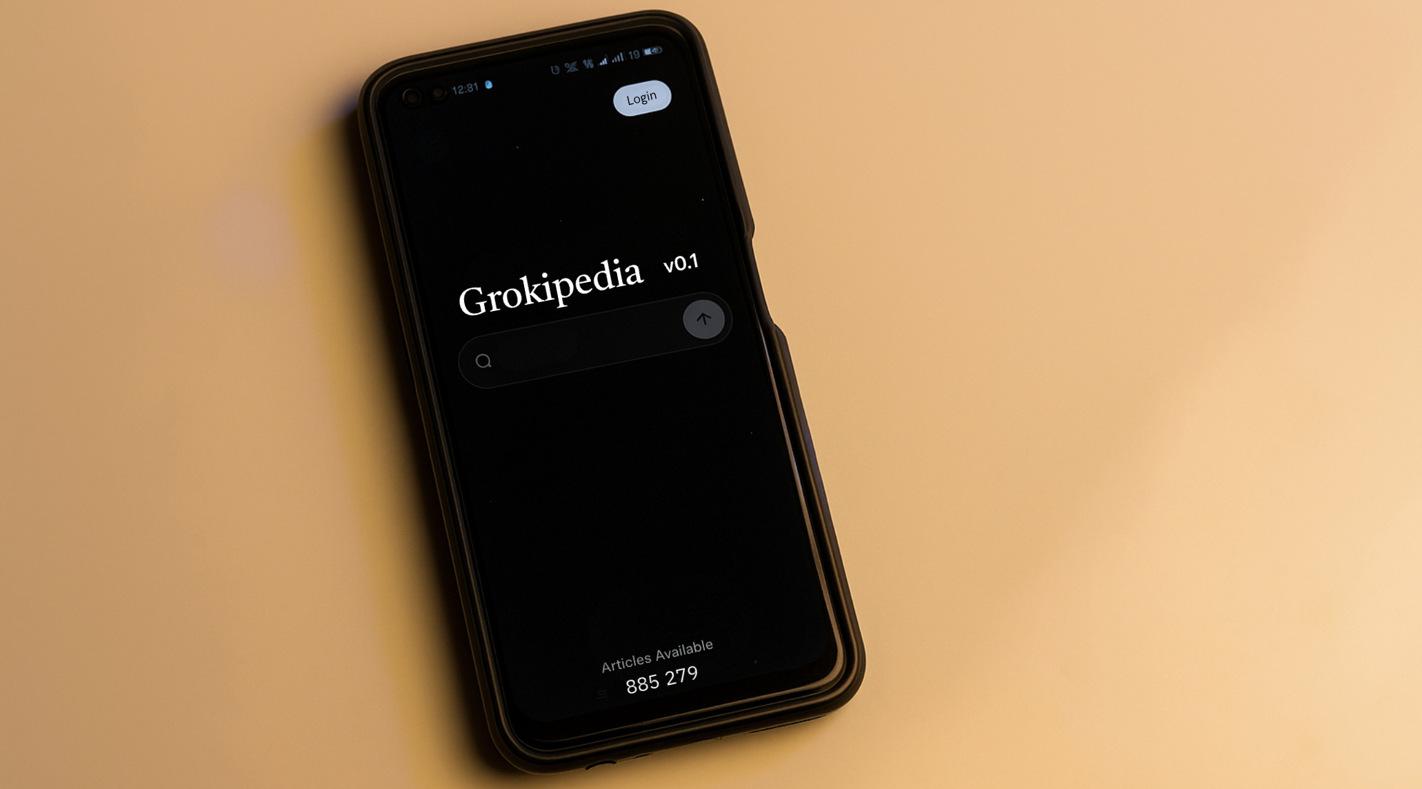 Smartphone screen displaying Grokipedia, an AI-powered encyclopedia, on a yellow background.