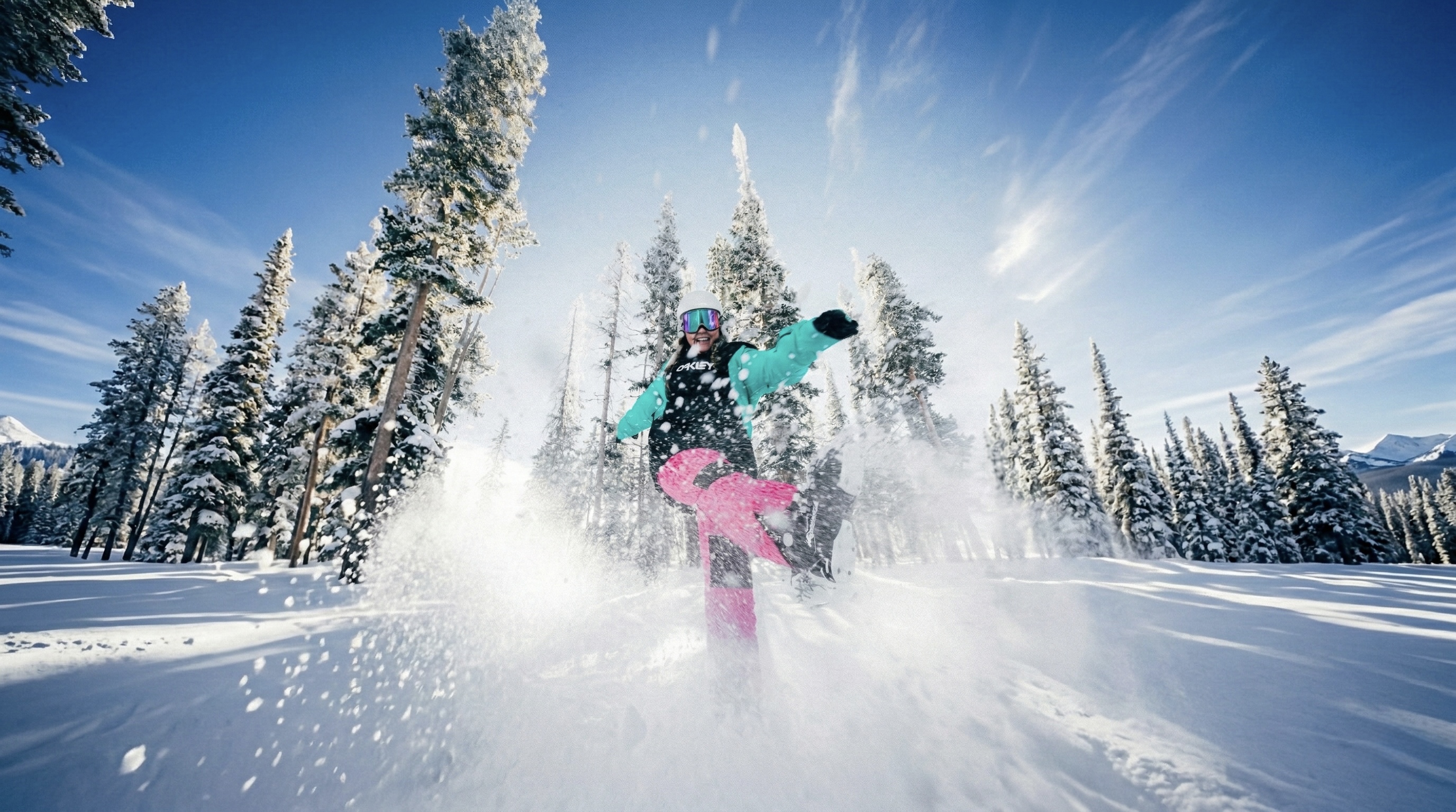 Woman snowboarding in the snow to illustrate popular winter sports in France in December.