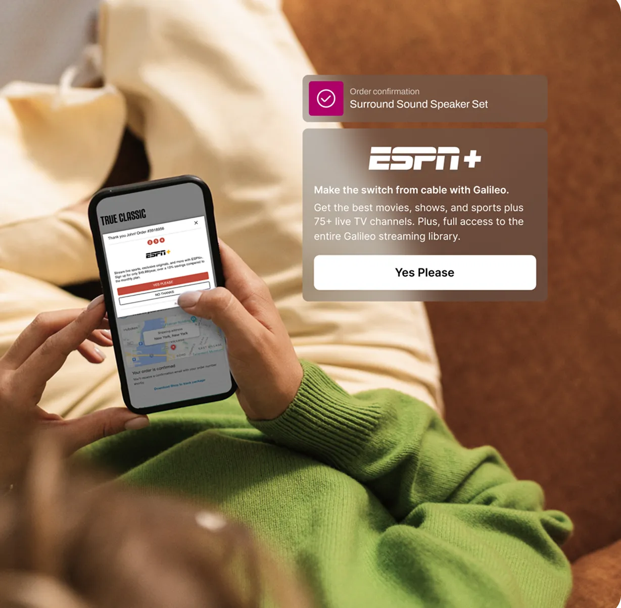 Person in green sweater holding a phone displaying an ESPN+ order confirmation with an overlay promoting ESPN+ streaming with 75+ live TV channels and a Yes Please button.