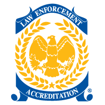 CALEA Law Enforcement Accreditation seal: a gold eagle within a laurel wreath on a blue shield.