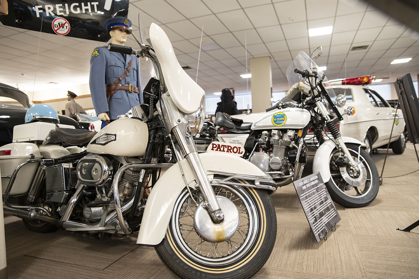 Vintage Highway Patrol motorcycles and automobiles.