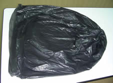 A single black trash bag submitted as evidence.