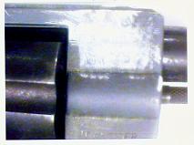 A metal surface where the serial number has been obliterated.