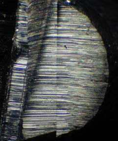 Striations left on a surface by a tool.