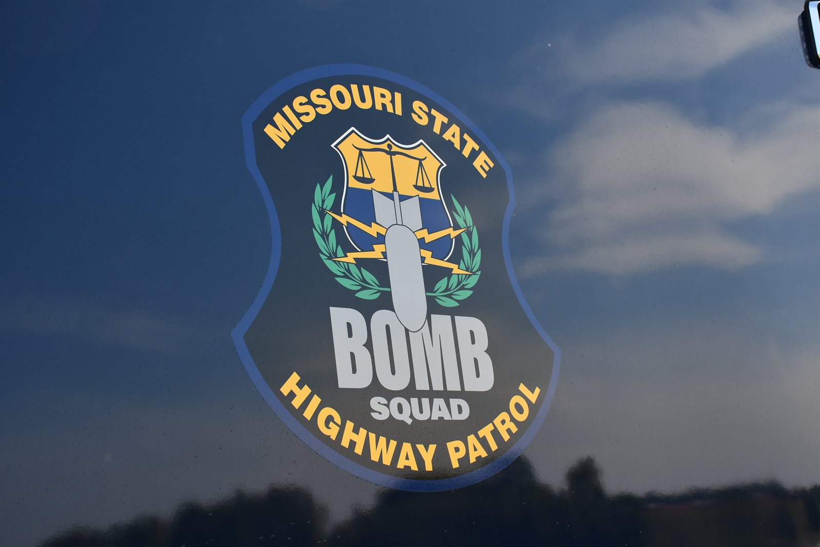 The Bomb Squad logo on the side of a unit truck