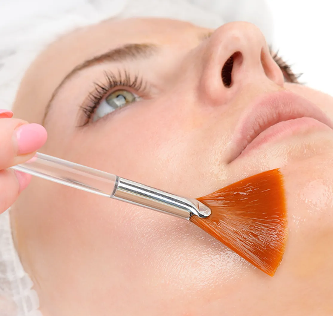 woman getting facial peel treatment