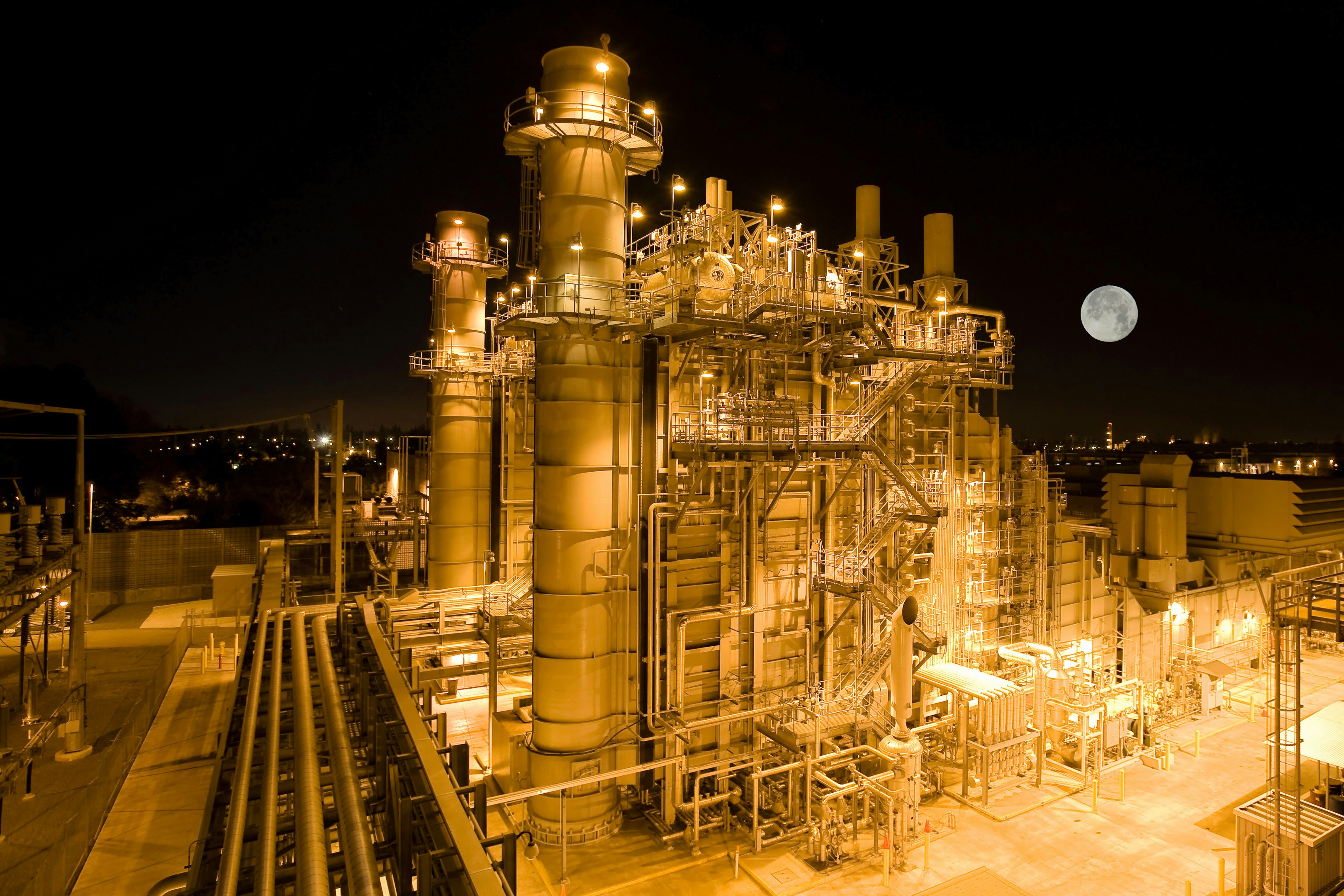 An aerial photograph of a power plant at night.