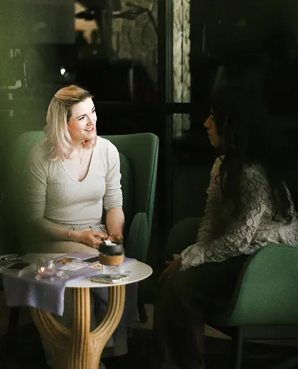 People chatting in a moody café