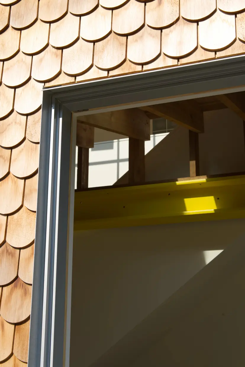 Banbury interior detail of door frame with round cedar wall cladding
