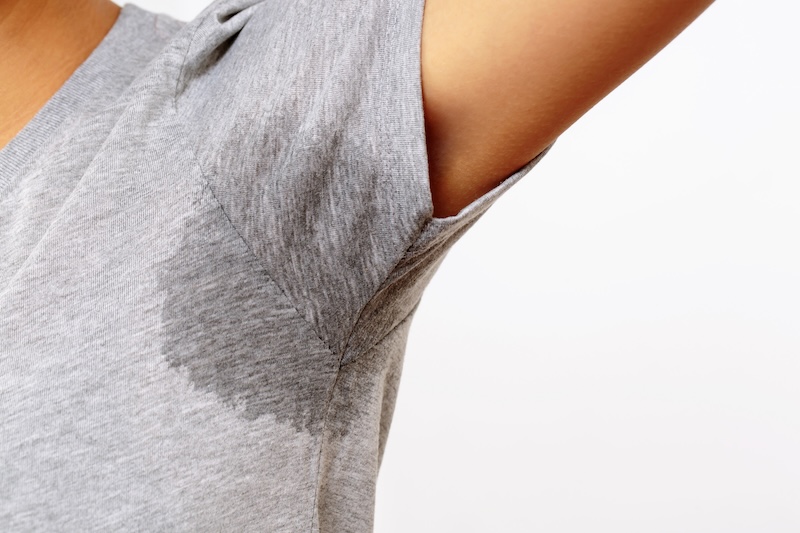 Sweating through shirt. 