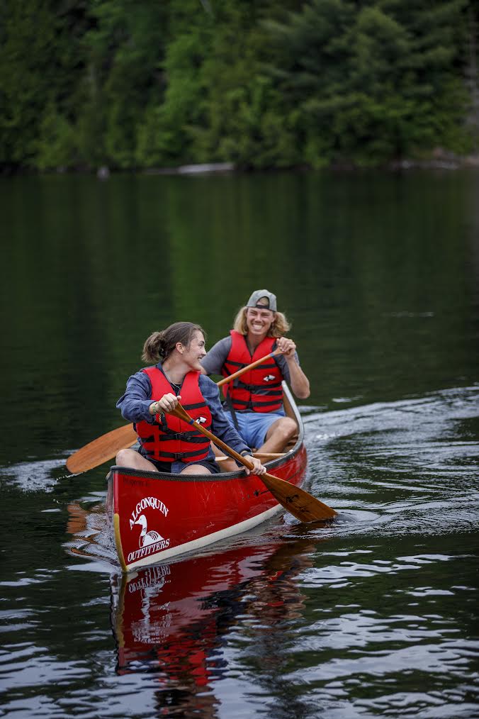 Paddlers in an Algonquin Outfitters canoe on an Algonquin lake
