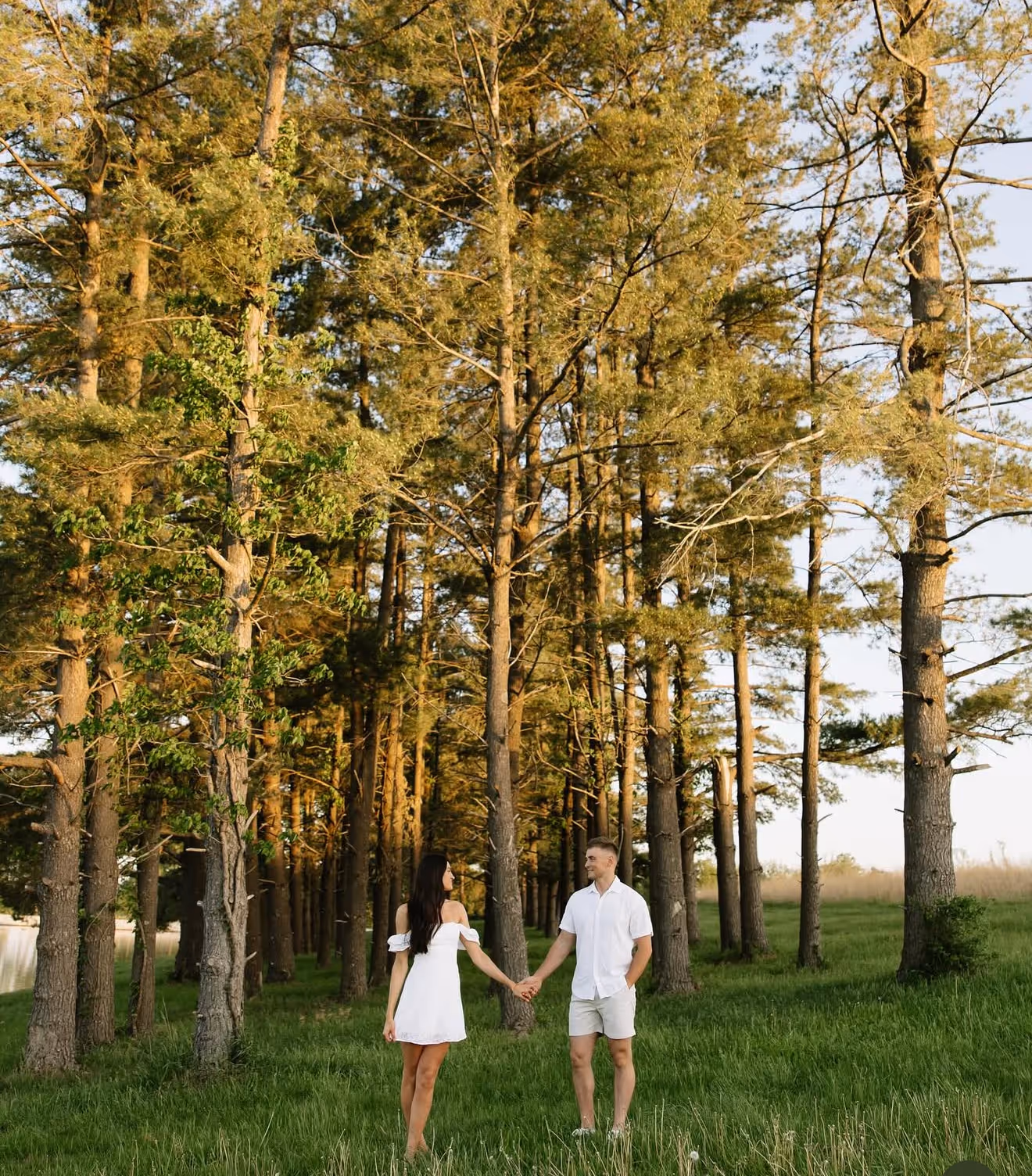A couple doing an engagement photo shoot at the Gathering Grounds in Bussey, Iowa